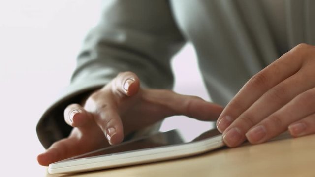 Businesswoman hands on tablet computer