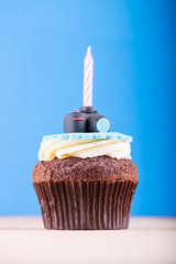 Delicious cupcake on table
