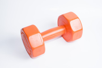 A orange dumbbell to exercise for healthy