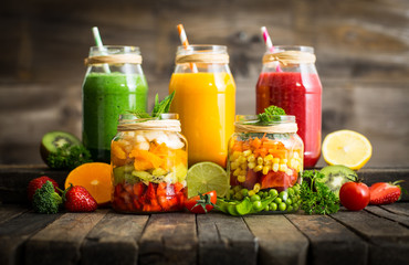 Healthy fruit and vegetable salad and smoothies in the jar 