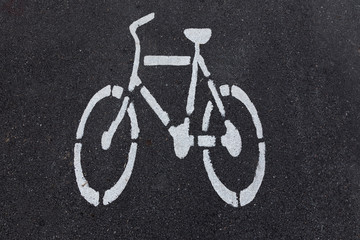 Fototapeta na wymiar bicycle sign on asphalt bike lane