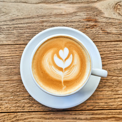 Cappuccino white cup on wooden background