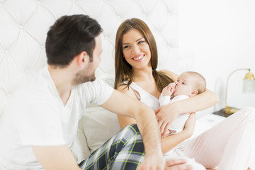 Fototapeta premium Happy family with newborn baby