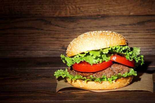Hamburger. Juicy burger on a dark background