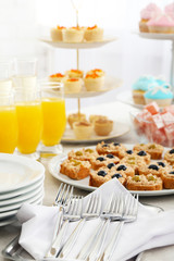 Set of cold snacks, canape, beverages and dessert, closeup