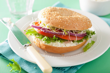 tomato sandwich on bagel with cream cheese onion lettuce alfalfa