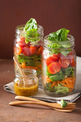 healthy vegetable salad in mason jar. tomato, broccoli, carrot,