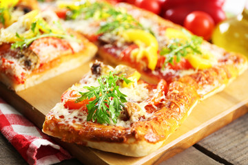 Pieces of delicious pizza on the table, close-up