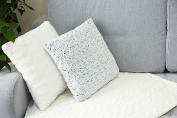 Fototapeta na wymiar Pillows on sofa in room