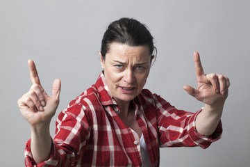 aggressive hand gesture with fingers like guns for manlike attitude