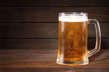 Beer. Cold beer in wineglass on a dark background.