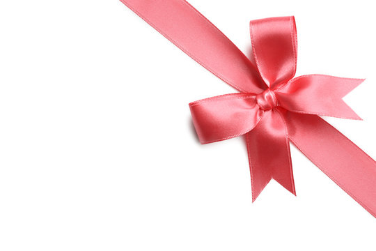 Pink ribbon bow on white background