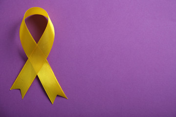 Yellow ribbon on purple background