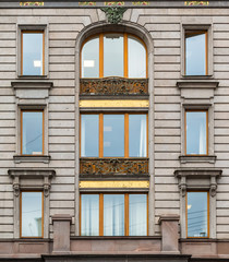 Several windows in a row on facade of Singer House front view, St. Petersburg, Russia