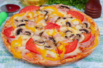 Homemade Hot Supreme PIzza with mushrooms, peppers, ham, tomato and cheese