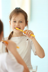 Cute girl with toothbrush