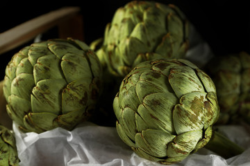 Fototapeta premium Artichokes in wooden box