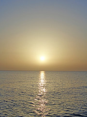 Solar halo over the sea at sunset