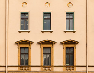 Several windows in a row on facade of urban office building front view, St. Petersburg, Russia.