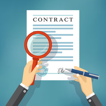 Hand checking contract with a magnifying glass.