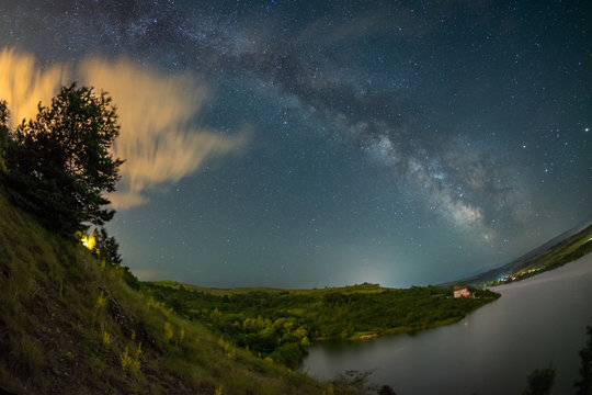 Milky way over lake Cincis in Romania with a fisheye lens