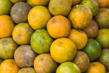 Stack of oranges on display at farmers market