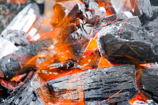 Wood charcoal and fire flames