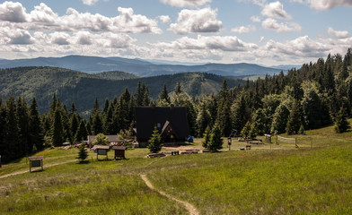 Hala Rycerzowa mountain meadow in Beskid Zywiecki mountains with mountain ranges panorama