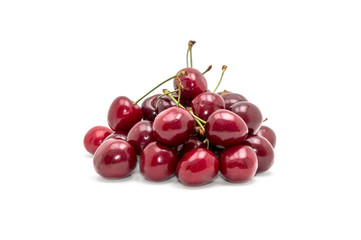 Heap of cherries on white