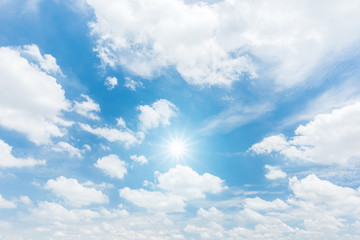 Naklejka na ściany i meble Sun with sunlight in cloud on blue sky background