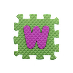Alphabet W puzzle pieces on white background