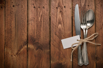Silverware with an empty tag on a table