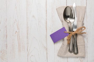 Silverware with an empty tag on a table