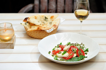 the Italian restaurant menu dish Caprese on the white plate