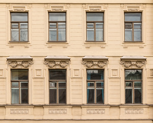 Several windows in a row on facade of the Saint-Petersburg University of Economics front view, St. Petersburg, Russia