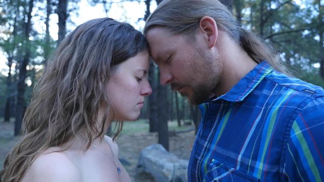 Close up of a man and woman with their heads together