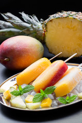 Pineapple mango strawberry sorbet ice cream popsicles.