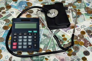 Stethoscope, calculator and wallet