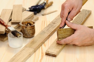 Carpenter hands at work with chisel