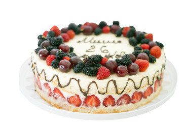 cake decorated with fresh fruits and chocolate