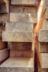 Stack of wooden bars. building material. Boards stacked