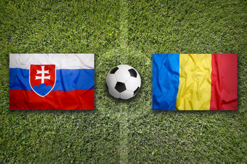 Slovakia vs. Romania flags on soccer field © BirgitKorber