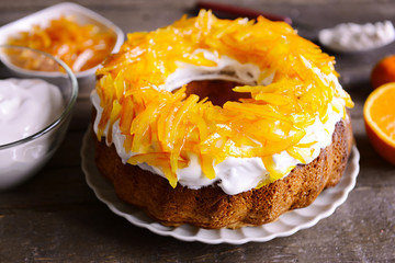 Delicious citrus cake on wooden background