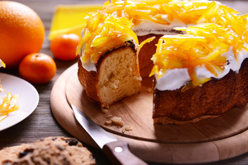 Delicious citrus cake on wooden background