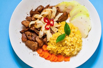 Roasted chicken piece, cheese, vegetable and saffron rice.