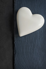 Chocolate heart on black slate