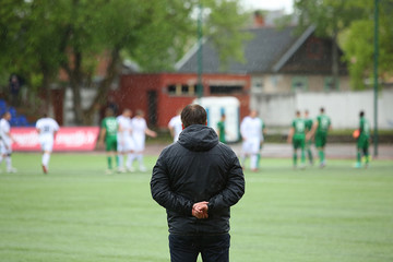 Footbal coach watching the match