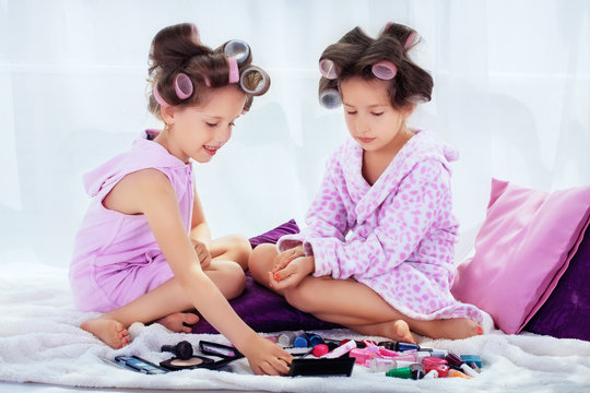 Two little girls in a curler make-up
