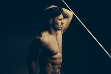 Muscular man near window