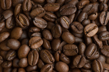 Brown coffee beans, closeup of macro coffee beans for background and texture